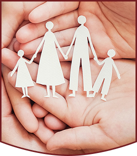 Adult and children hands holding paper family cutout